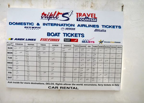 Ferry schedule at a Mykonos travel agency.