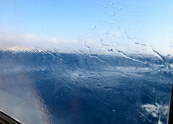 The view from a SeaJet window approaching Santorini.