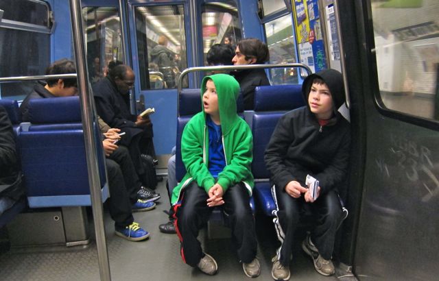 The kids riding the Paris Metro.