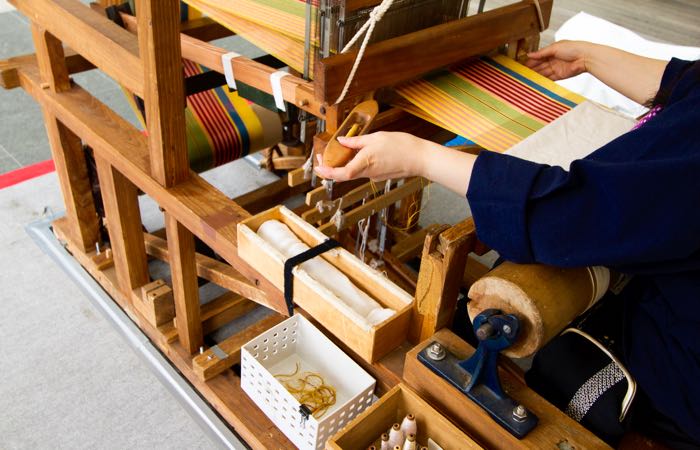 See how Japanese fabrics are made at Nishijin Textile Center in Kyoto