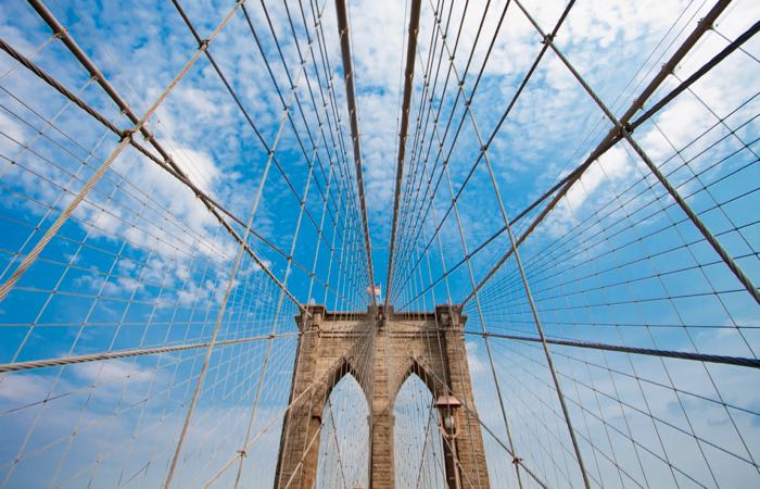 The Brooklyn Bridge spans New York's East River from Manhattan to Brooklyn.