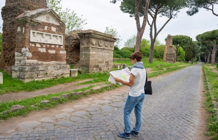 Via Appia Antica, "the Appian Way," has ruins of Roman buildings and sculptures, heritage of early Italian history.
