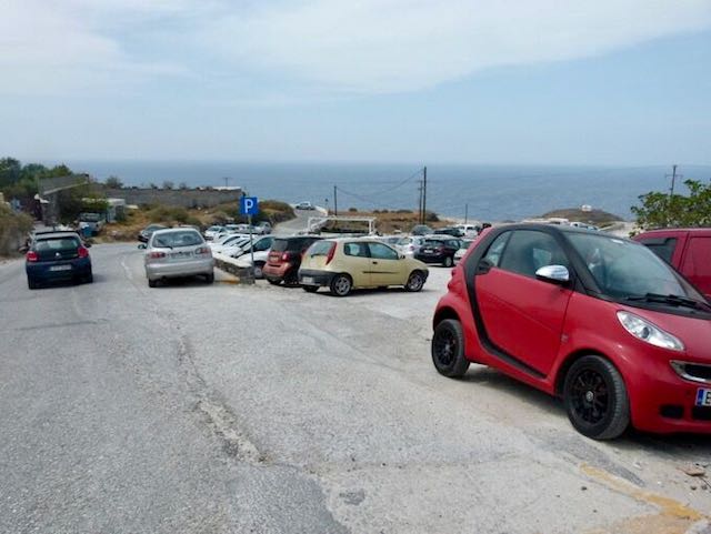 Parking area in Oia, Santorini for rental cars.