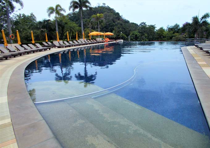 Large, kid-friendly pool surrounded by greenery at Pakasai Resort
