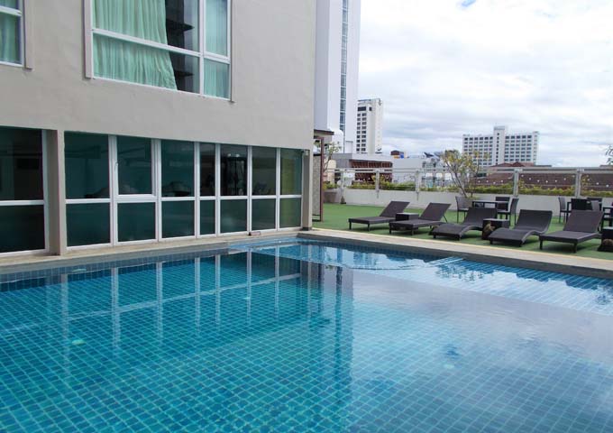 Unshaded pool with astroturf at Movenpick Suriwongse Hotel