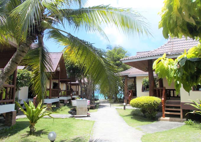 Stylish bungalows clustered together overlooking the sea at Phi Phi Villa Resort