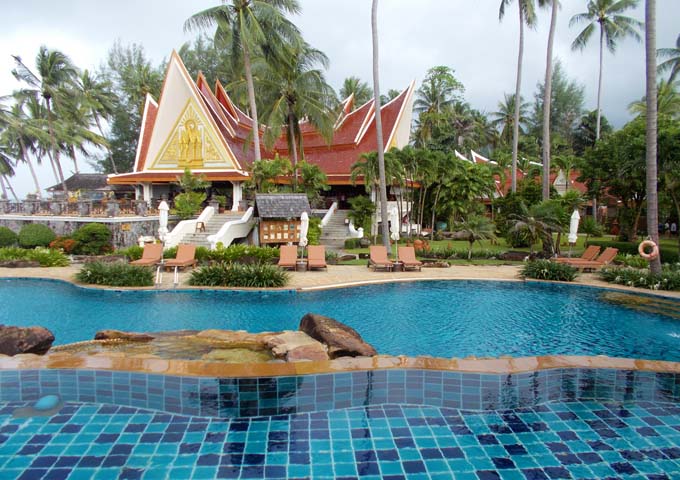 Pool set among tropical gardens and Thai architecture at Santhiya Tree Resort