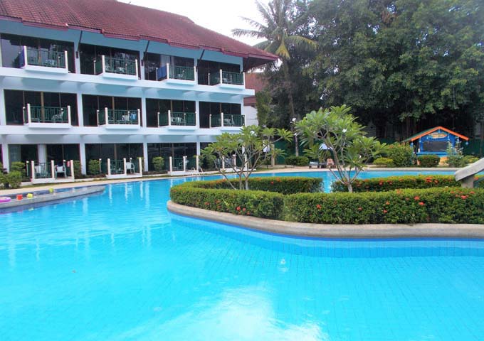 Large pool and motel-style rooms at Amora