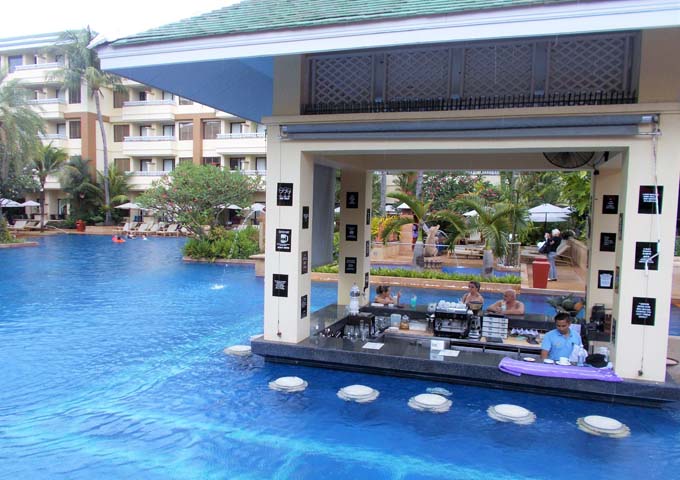 1 of 4 pools with bar at massive and elegant resort