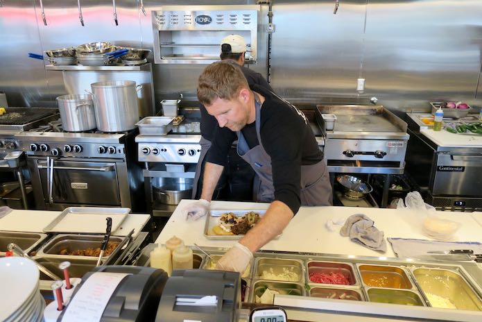 Chef and kitchen at Super Bueno Seattle.