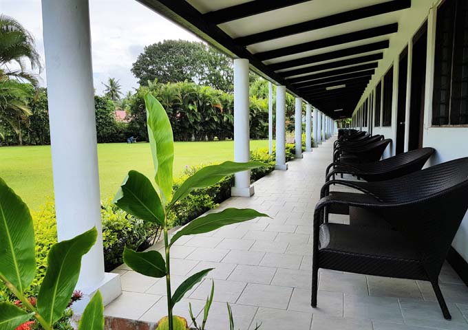 Shared patio of lawn-facing rooms.