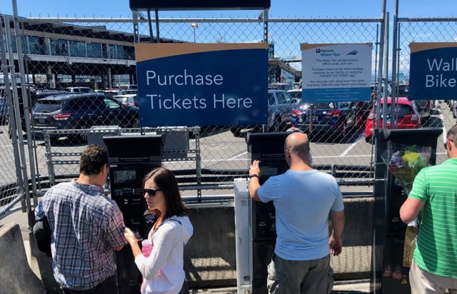 Buying tickets for Seattle Bremerton fast ferry.