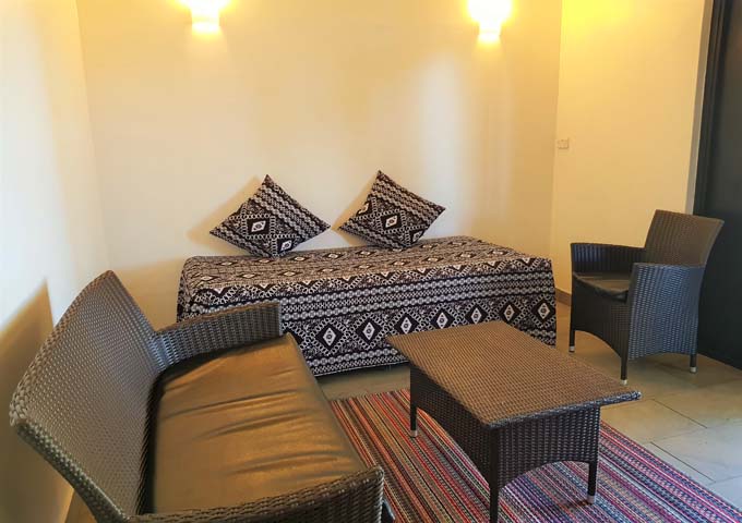 Simple lounge area features Fijian decor.