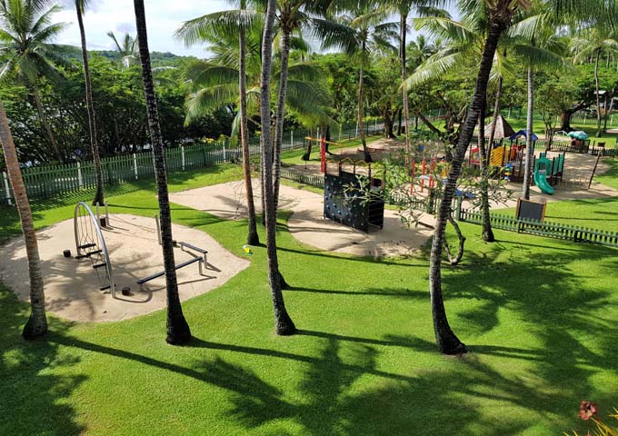 Children have a big and shaded playground to play in.