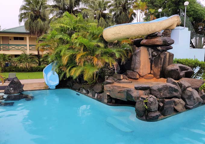 Family-friendly resort has a waterslide by the pool.