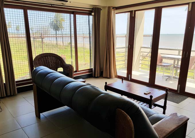 Plush leather sofa complements the beautiful sea and beach views.