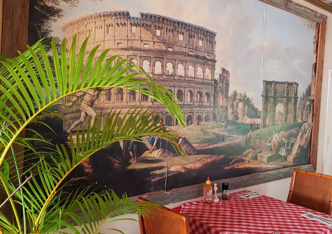 Huge paintings of Italy adorn the restaurant walls.