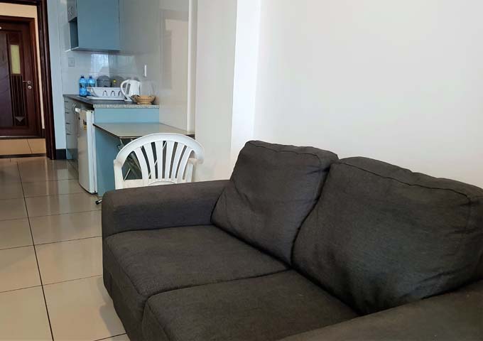 All rooms feature a small comfortable sofa.