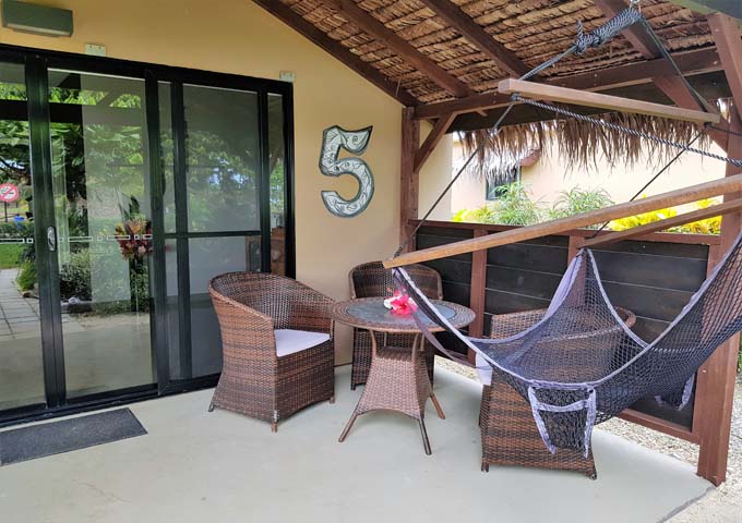 Bungalow patios are spacious and feature furniture and a hammock.