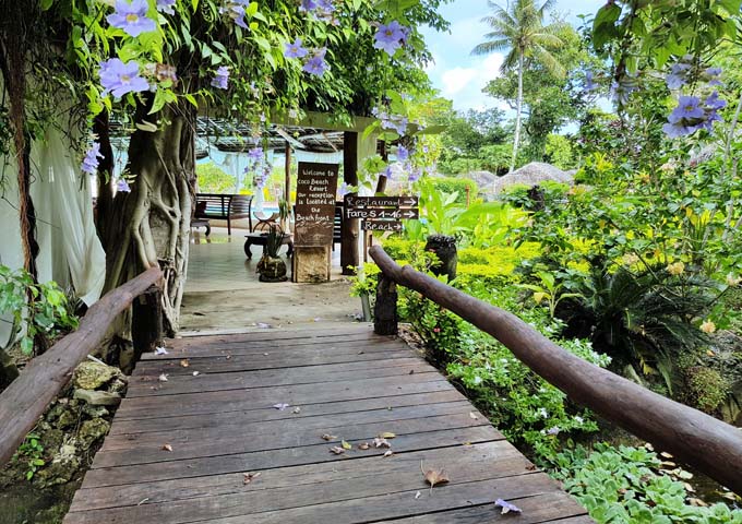 A rustic boardwalk connects the entrance to the rest of the resort.