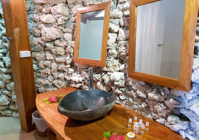 Stone-walled bathrooms are very attractive.