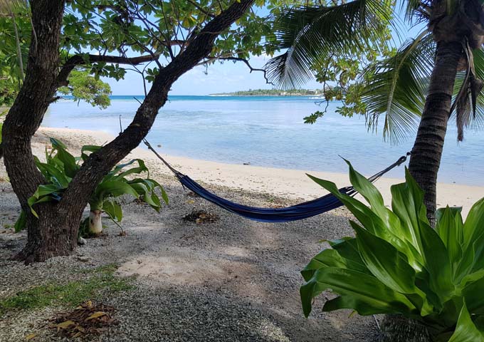 Hammocks tied to palms give a tropical vibe.