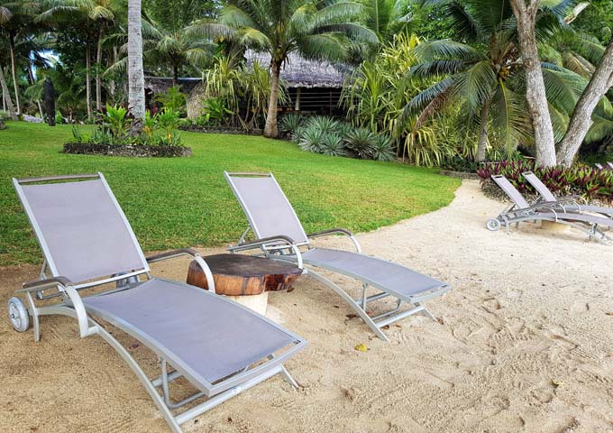 Resort provides lounge chairs on sandy areas.