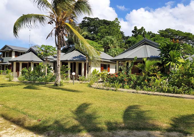 Villas and bungalows are spread across tropical gardens.
