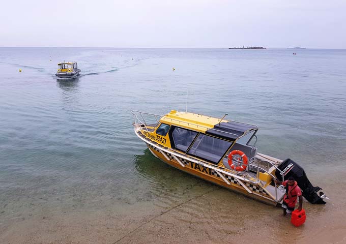 Boats depart for neighbouring islands from Anse Vata.