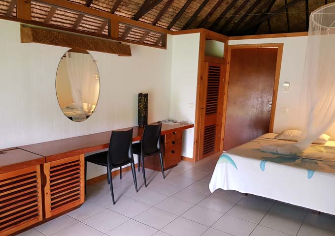 The spacious bungalows feature wooden furniture.
