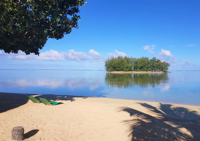 The lodge's perfect beach faces a motu atoll close by.