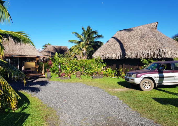 The lodge offers vehicle parking close to the bungalows.