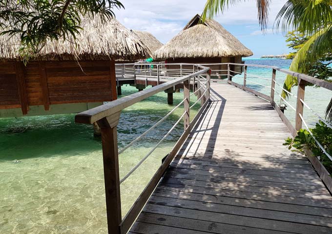 Overwater Bungalows are accessible using a wooden walkway.