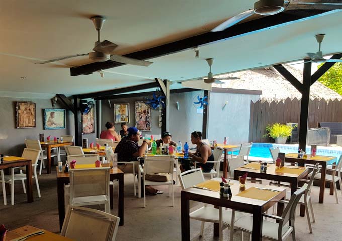 Lucky House is popular for its pizzas and poolside setting.