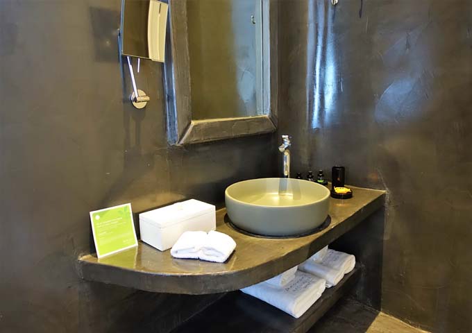The suite's bathroom features a traditional style.