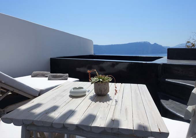 The private terrace features an infinity plunge pool and furniture.