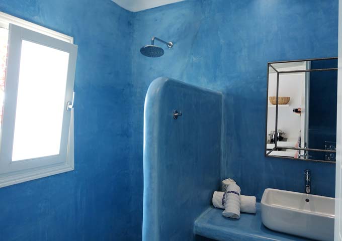 The studio bathrooms feature a colorful Cycladic style.
