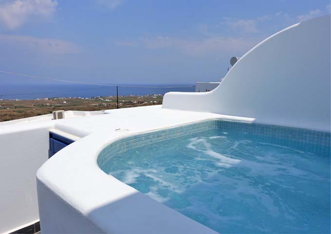 The jacuzzi in the Superior Studios offers views of the Aegean Sea.