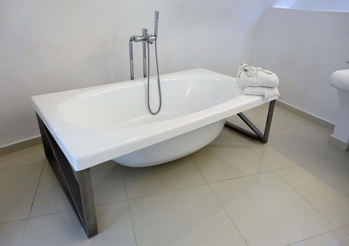 The bathtub is small and simple.