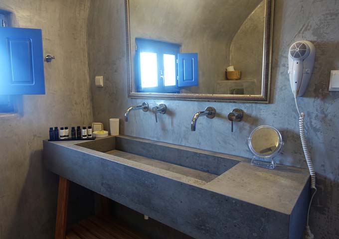The Honeymoon Suite's newly-renovated bathroom features a cave-style decor.