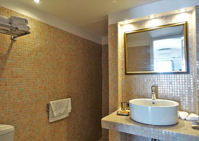 The spacious and modern bathroom has an open-style shower.