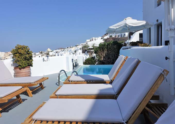 The quiet pool deck has many sun-loungers.
