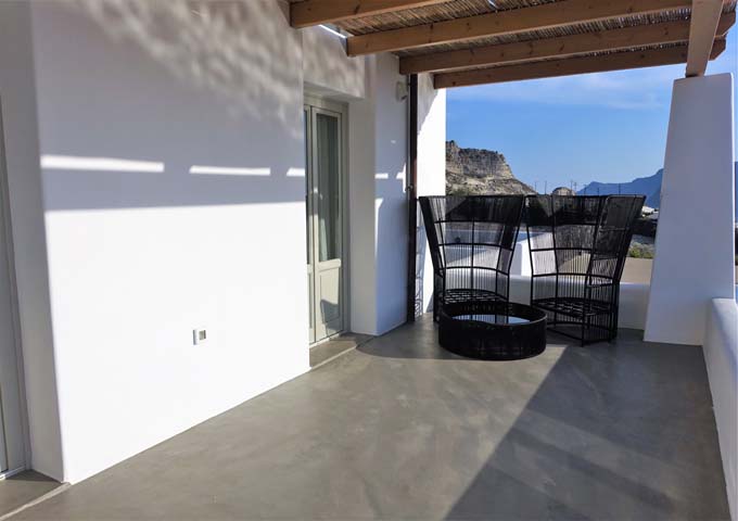 The living area also connects to a terrace with sea views.