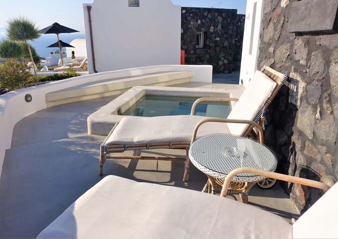 The Deluxe Suite's terrace has a jacuzzi and sunbeds.