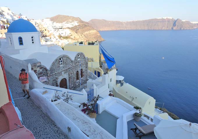 The view to the east is of the caldera, church, Skaros Rock, and multiple villages.