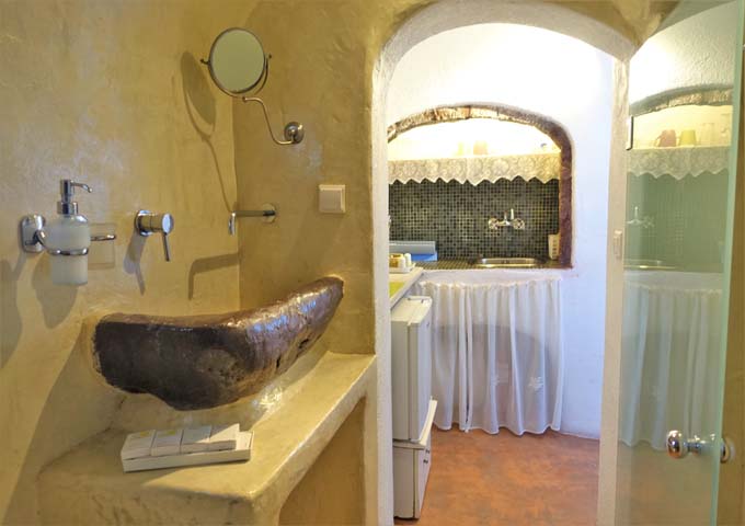 The studio has a small cave-style bathroom.
