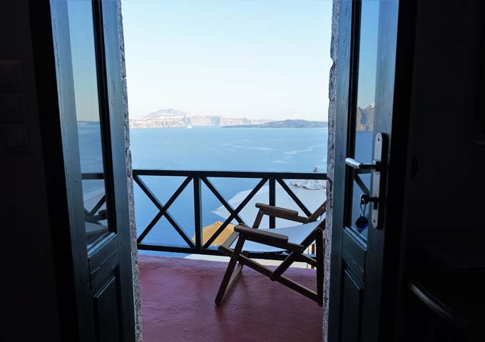 The bedroom opens onto a small balcony with fantastic views of the caldera.