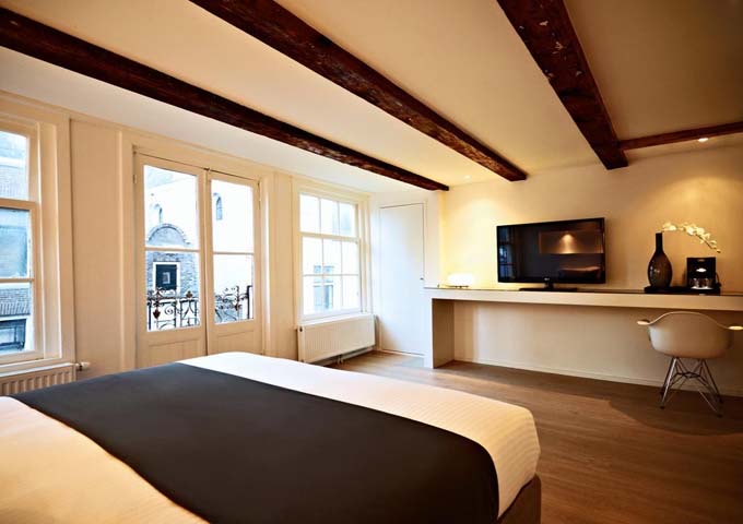 Junior suites feature large wooden beams in the ceiling.