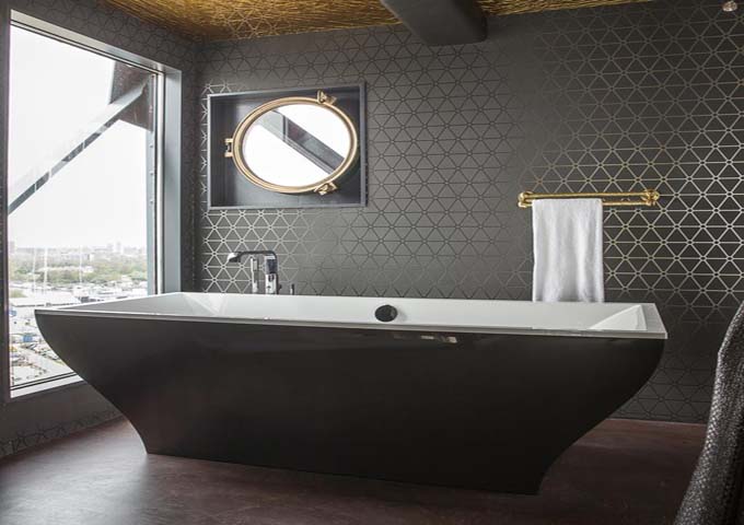 The Mystique Suite has a free-standing tub with city views.