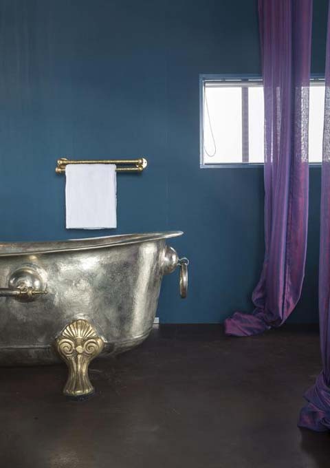 The suite's tub is claw-footed and free-standing.